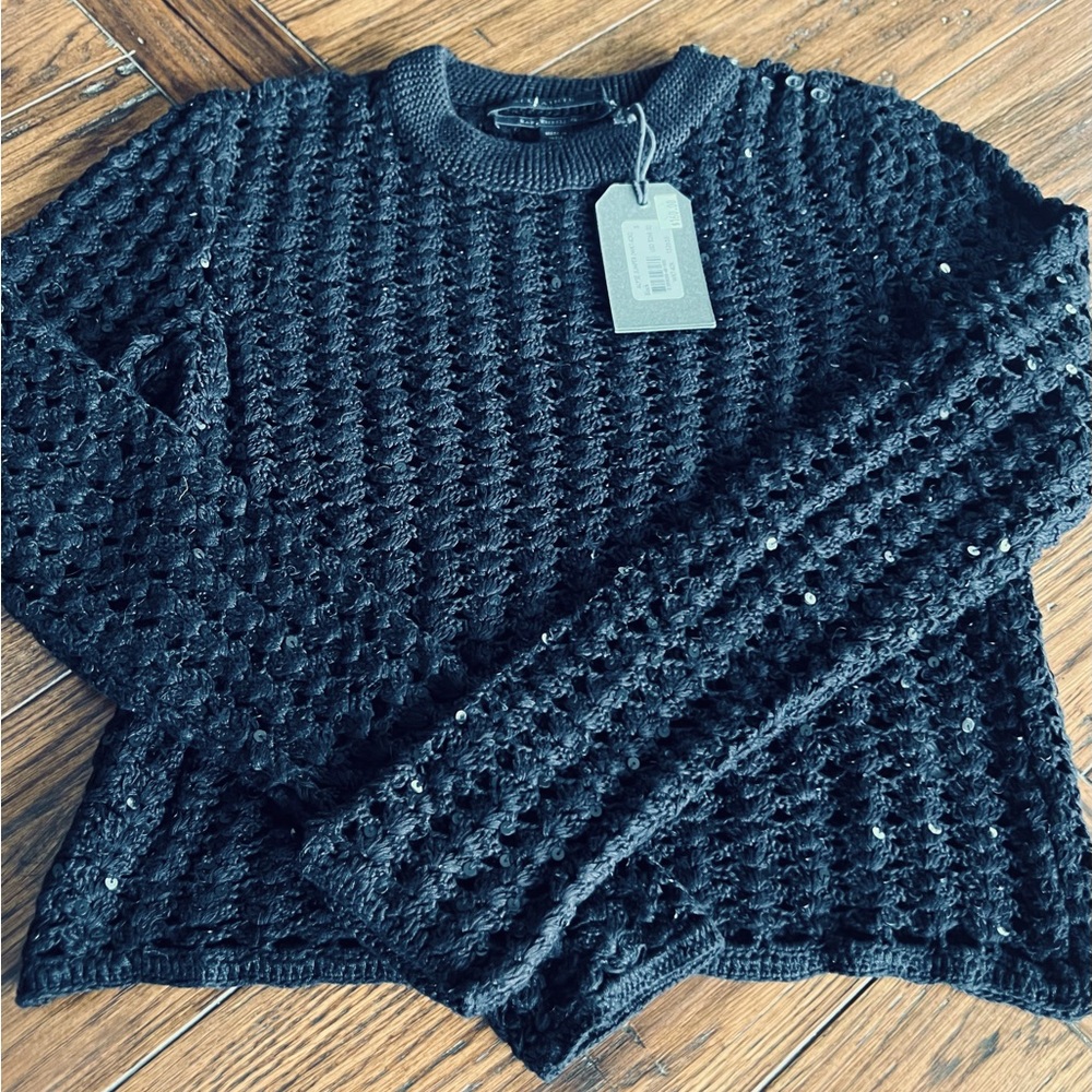 Beautiful BLACK sweater/top with hand sewn black sequins. Crew neckline.